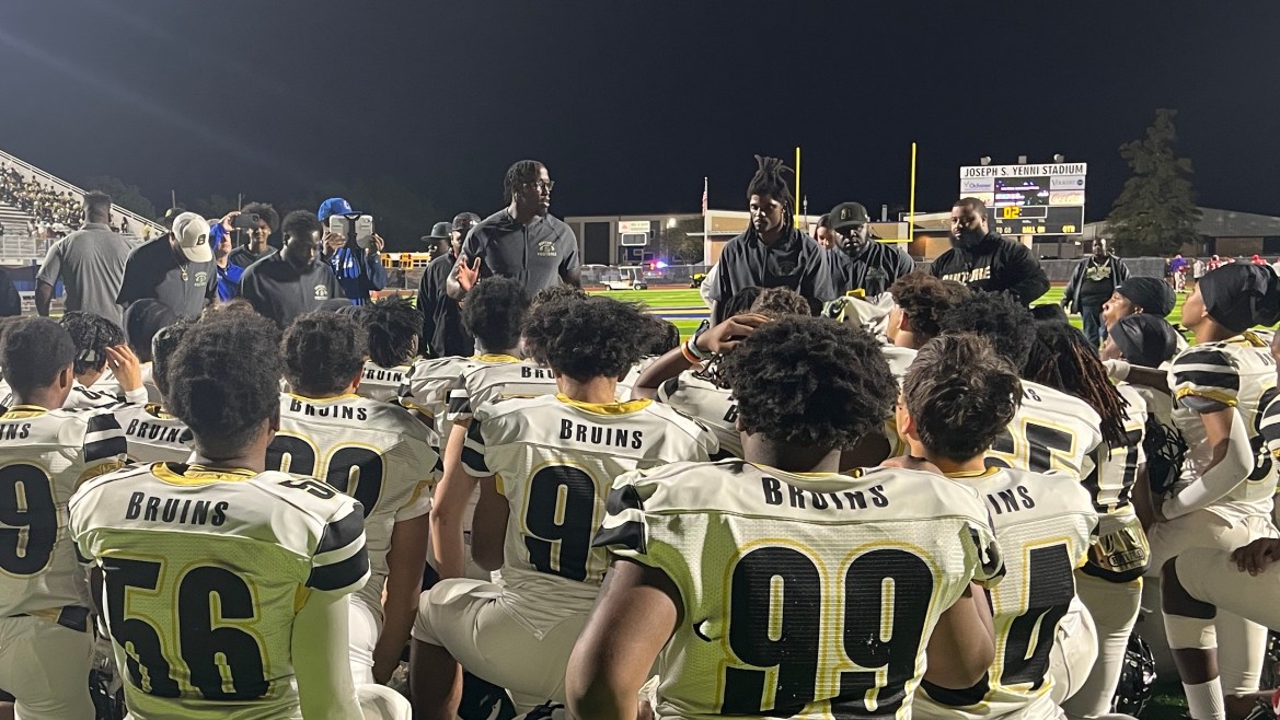 Bonnabel coach Andre Anthony talks to the Bruins after Thursday's playoff win vs. Riverdale.