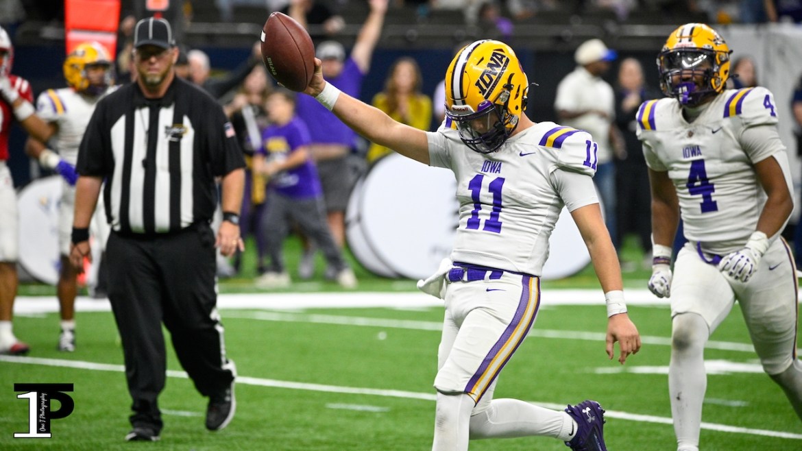 Iowa quarterback Lawston Broussard scores the final touchdown in the Yellow Jackets' first state championship in program history Friday.