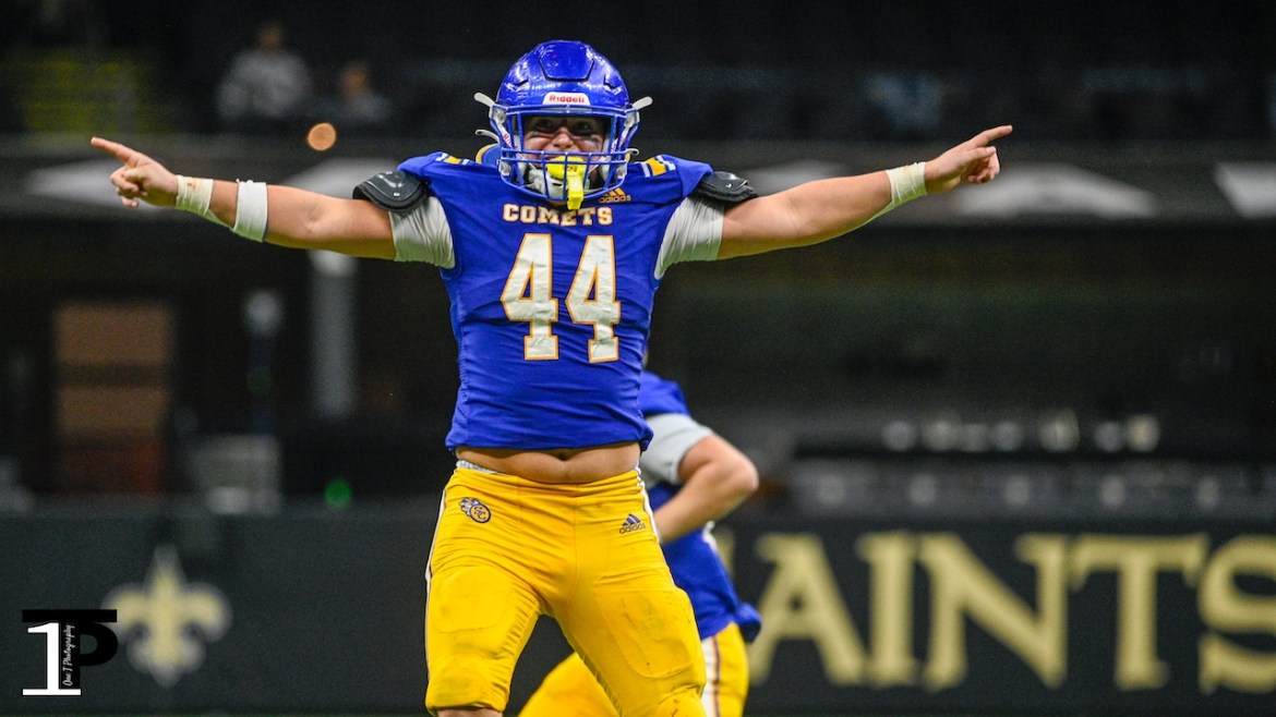 St. Charles Catholic long snapper Creed Marix celebrates the Comets' game-winning field goal Friday.