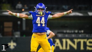 St. Charles Catholic long snapper Creed Marix celebrates the Comets' game-winning field goal Friday.