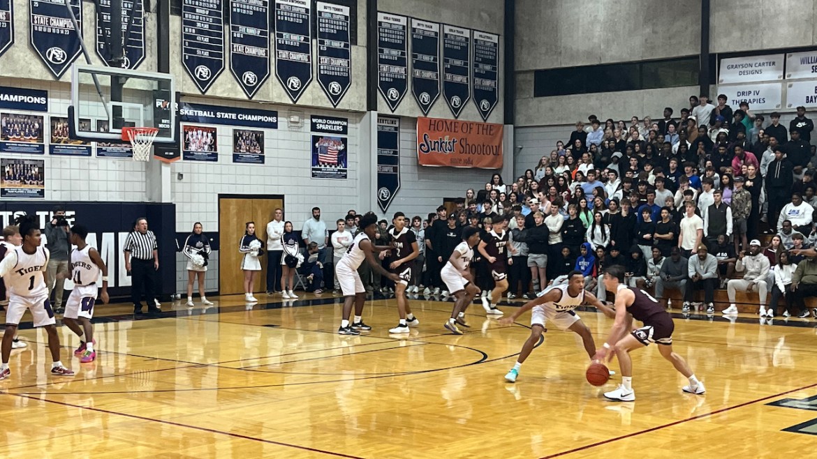 Westgate's Shadon Lee guards St. Thomas More's John Michael Charbonnet in the 2025 Sunkist Shootout championship game Monday.